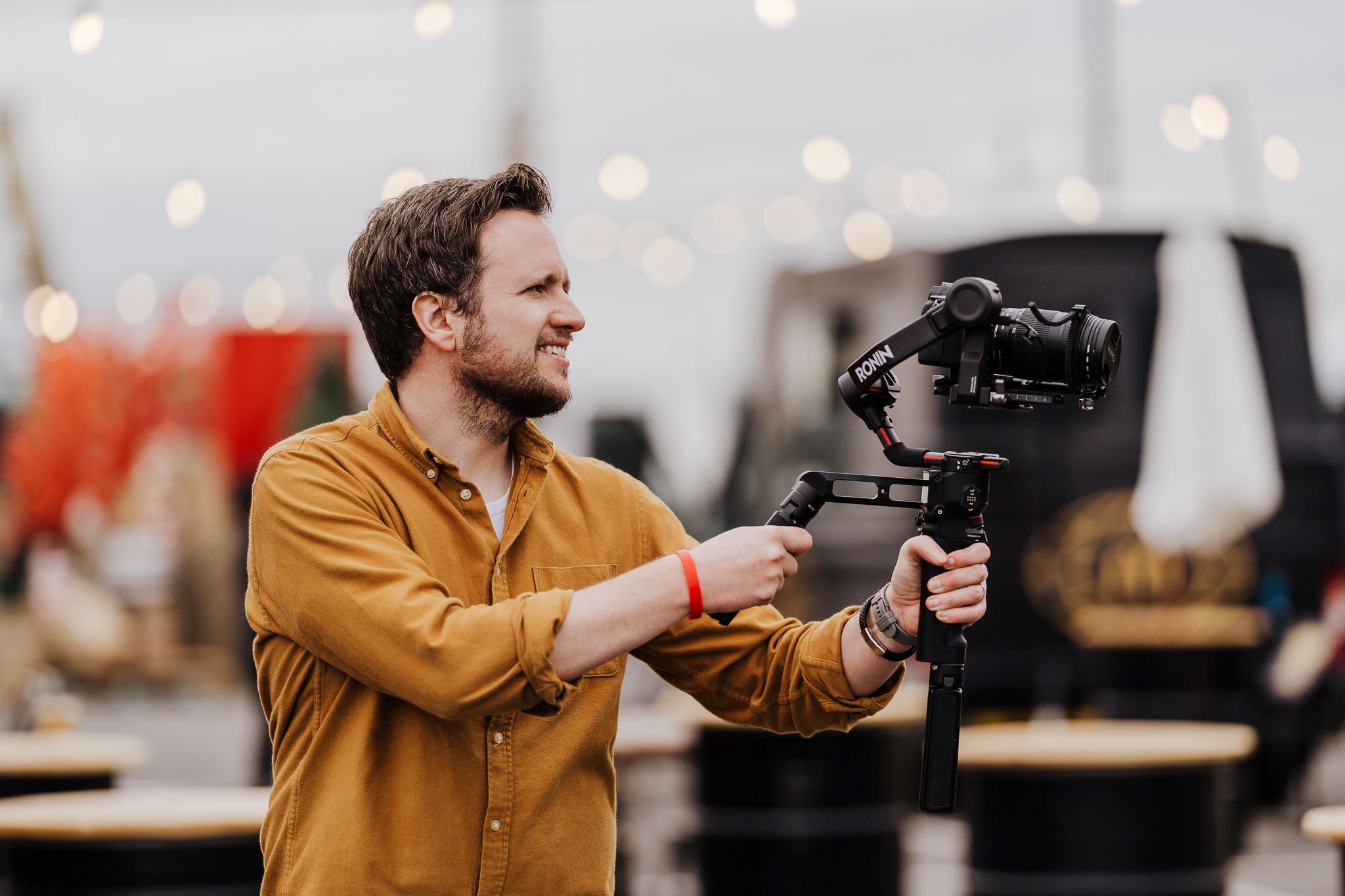 An image of Dandelion videographer Adam Hanslow-Smith, filming an event for McDonalds.